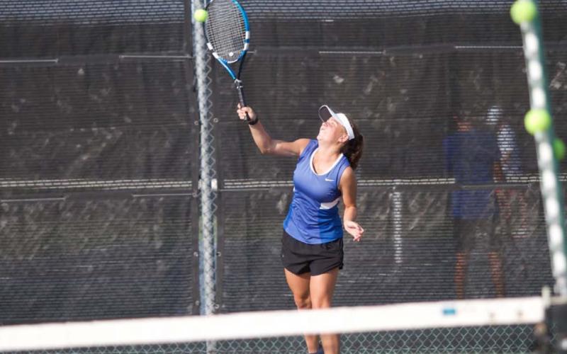 Abby Valdez makes contact with a serve during the squad’s recent matches against Belton last Friday. The tennis team is set to start district play on Thursday. HUNTER KING | DISPATCH RECORD