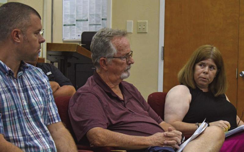 At right, Lampasas Central Appraisal District Chief Appraiser Susan Jones introduces LCAD Board of Detectors, from left, Chairman Marshall Brewer and Philip Garrett during Wednesday’s LISD Board of Trustees called meeting. ERICK MITCHELL | DISPATCH RECORD