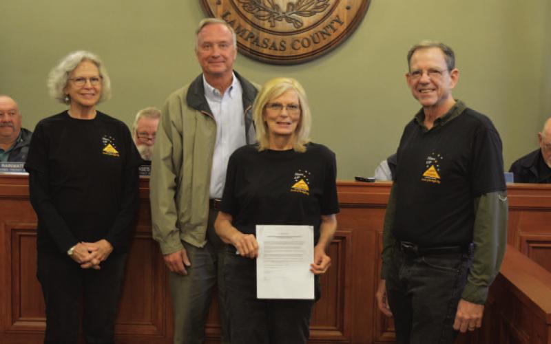 Members of Lampasas County Friends of the Night Sky pose for a photo with the Lampasas County Commissioners Court, which approved a proclamation to name February 2023 “Night Sky Awareness Month.” Standing are, from left to right, Night Sky committee member Jane Watson, County Judge Randy Hoyer, and Night Sky committee members Dorothy Person and Mike Watson. ERICK MITCHELL | DISPATCH RECORD
