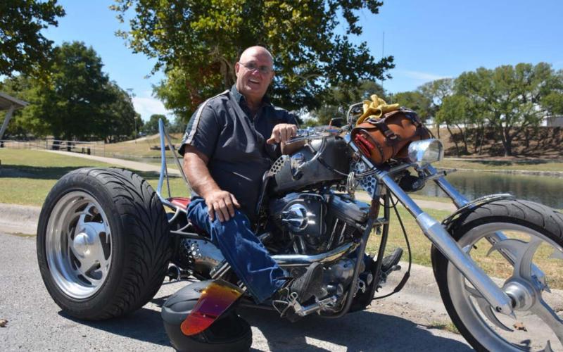 Lampasas native David Wear poses at W.M. Brook Park with his custom ride ‘Addiction,’ built by Wear himself. MONIQUE BRAND | DISPATCH RECORD
