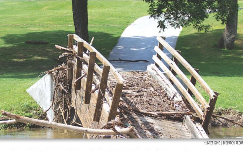 The wooden bridge on hole number six collapsed because of rushing water.