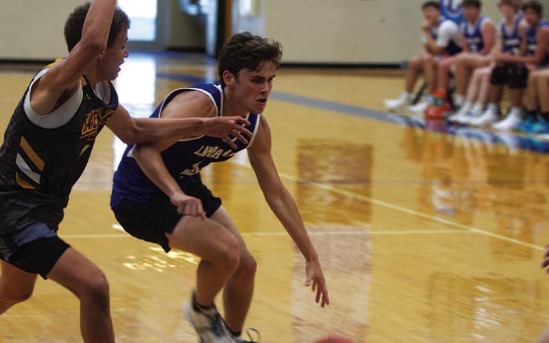 Trent Seneca drives past a Gatesville defender during game on Monday evening. HUNTER KING | DISPATCH RECORD