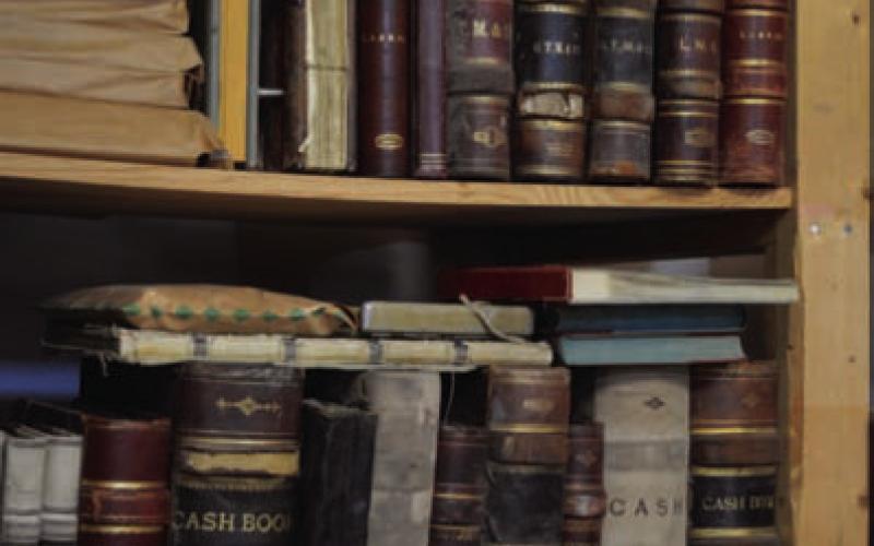 Old journal, minutes and cash log books from the bank’s inception sit in a storage room within First Texas Bank. ERICK MITCHELL | DISPATCH RECORD