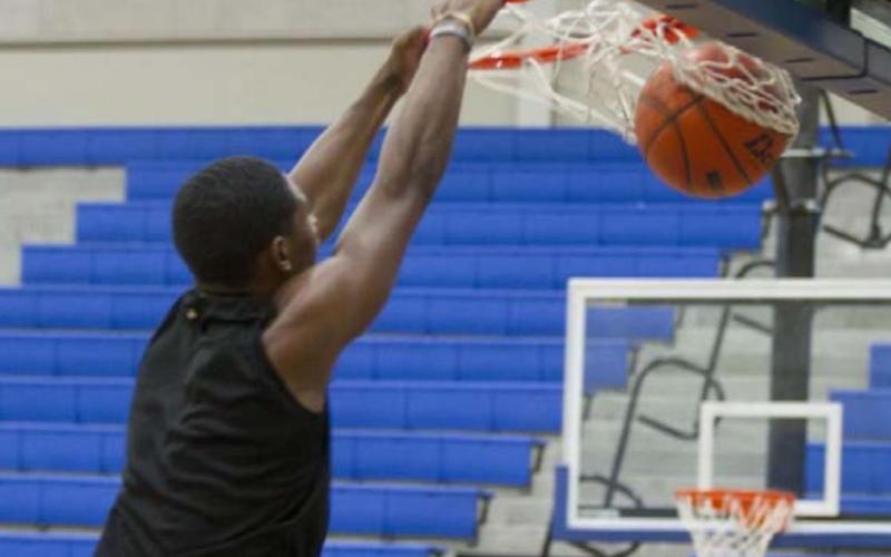 Johnki Gardner slams a ball home during practice on Wednesday. HUNTER KING | DISPATCH RECORD