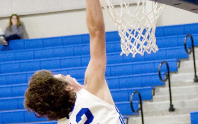 Landon Mulcahy scores a slam dunk in the fourth quarter on Monday against the Thorndale Bulldogs. JEFF LOWE | DISPATCH RECORD