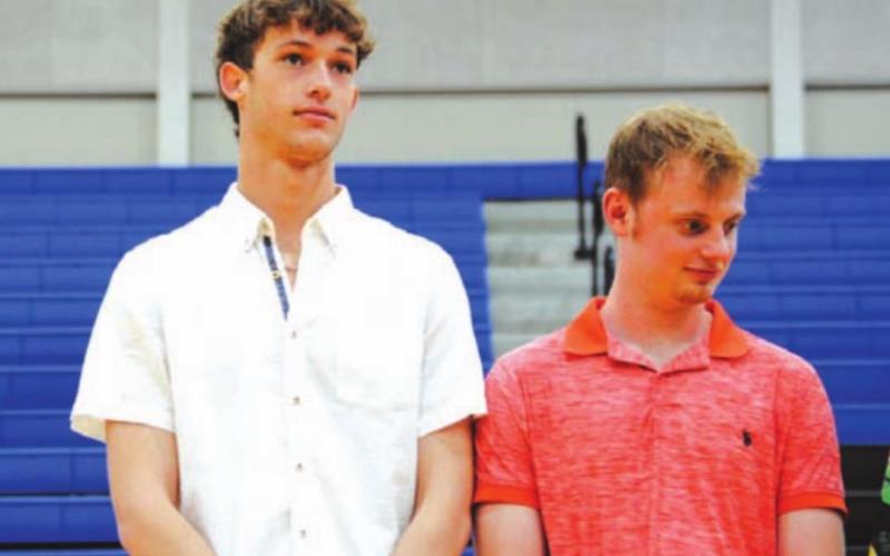 Seniors Kaeden Crawford, left, and Quinn Pace, stand in line after receiving awards. HUNTER KING | DISPATCH RECORD