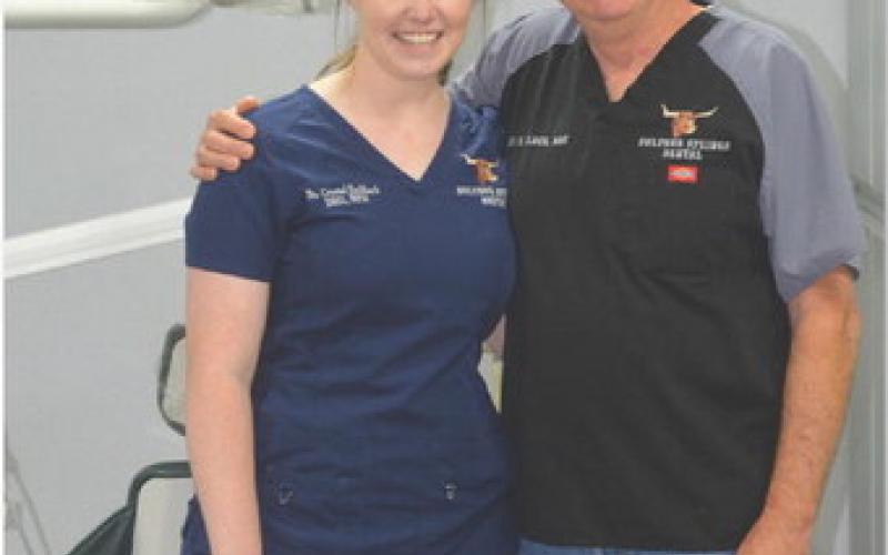 Crystal Eschbach is pictured with her father, fellow dentist Jay Elder. erick mitchell | dispatch record