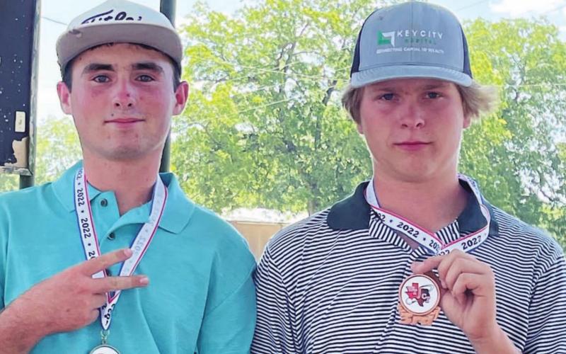 Peyton Spore, left, and Nick Haas pose with their second-and third-place medals from the San Saba tournament. COURTESY PHOTO
