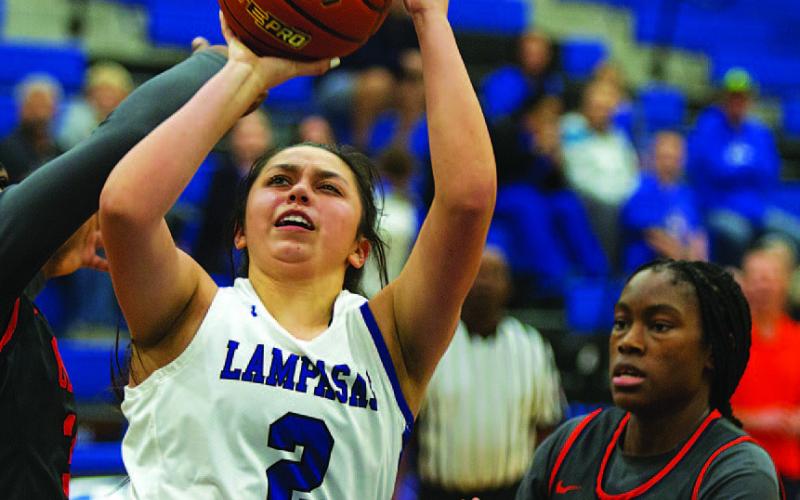 HUNTER KING | DISPATCH RECORD Johnnie Lewis fights through contact for a tough finish against Leander Glenn on Tuesday.