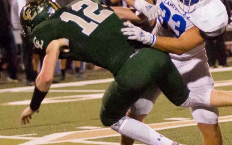Josh Carter hits Canyon Lake quarterback Peyton McMullen on a pass play last week. Lampasas (4-0 in district, 7-0 overall) will host Fredericksburg (1-3, 5-4) Nov. 6 at 7:30 p.m. JEFF LOWE | DISPATCH RECORD