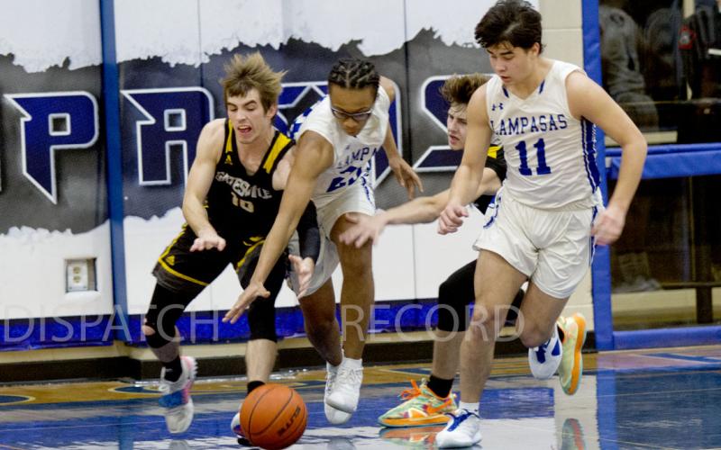 In the Badgers' 89-42 win over Gatesville on Friday, Niko Lewis (23) goes for a steal and Tak Stinnett helps on defense.