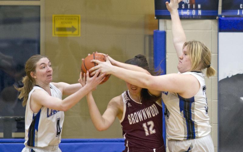 Taylor Allen, left, and Kyliegh Ball guard a Brownwood Lady Lion.