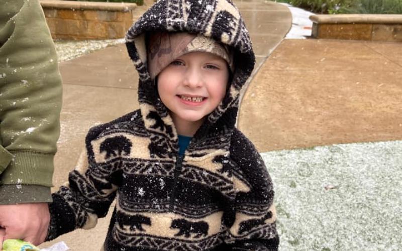 Graysen Hargrove enjoys the winter weather after recovering from heart surgery at Dell children's medical center.