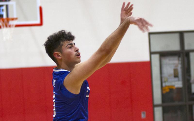Anthony Ortiz sinks a three-pointer in the third quarter.