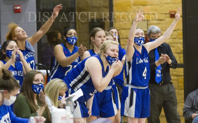 The Lady Badger bench celebrates a big play in the first half.