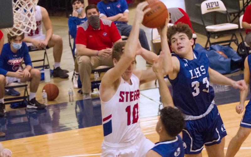 Carter Johnson (33) and Anthony Ortiz (1) swarm to the ball.