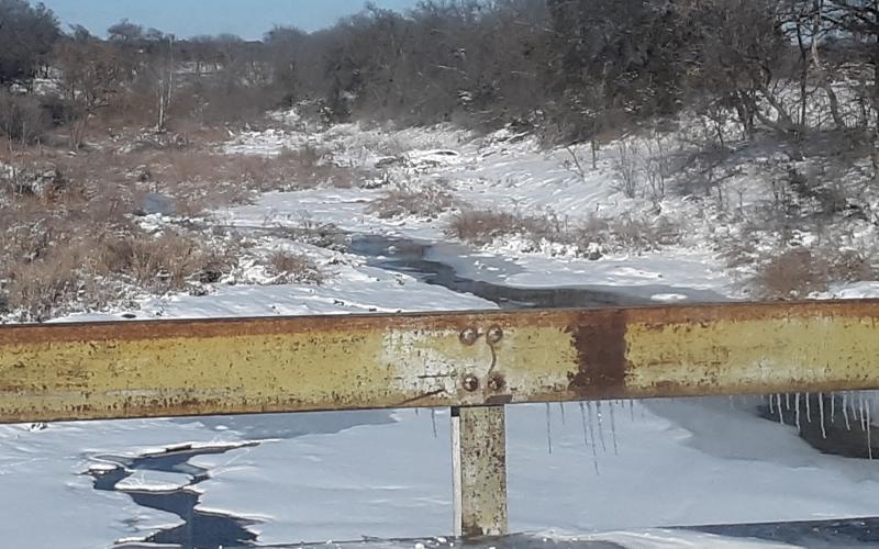 A partially frozen Mesquite Creek is shown along U.S. Hwy 183.