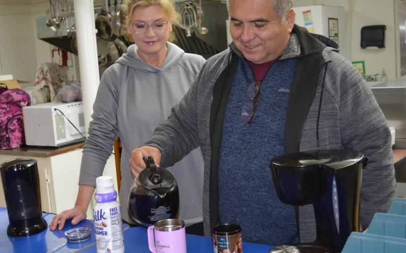 Sheriff Jess Ramos and his wife, Rebecca, serve coffee at St. Mary Catholic Church, which offered a warming station during single-digit temperatures.