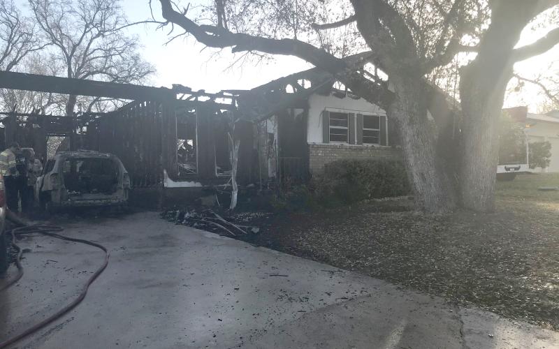 A fire early Monday morning severely damaged a house on Snell Drive. The blaze displaced four people and killed three pets. | Photo by Monique Brand
