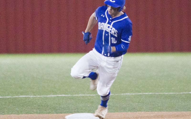 Ace Whitehead rounds second base on a triple. He scored on this play after a Glen Rose error on the throw to third base.