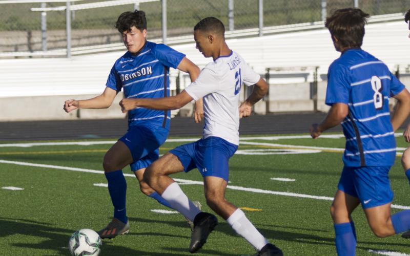 Andrew Grant (21) scores the first goal of Friday's game before an eventual Robinson Rocket comeback.