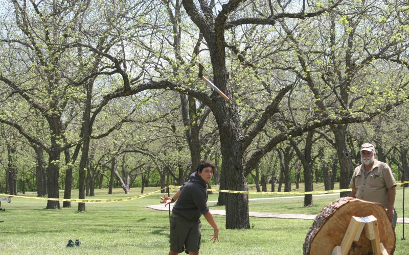 Luke Coonrod, 16, from Troop 200 in Lampasas, throws a tomahawk during the San Saba Mountain Man Campout. | Photo by Sherryl-Lynn Gooch