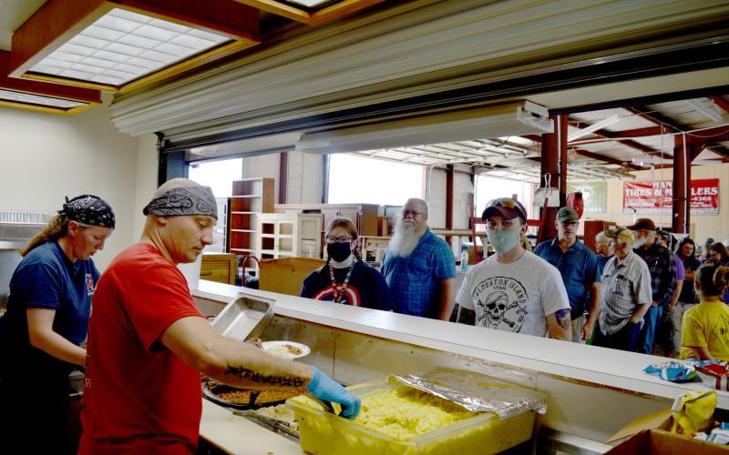 Kempner Volunteer Fire Department firefighters Tracie and Steve Martin serve meals during the department’s annual barbecue and auction fundraiser on Saturday