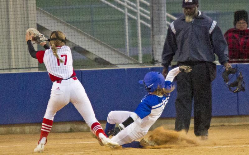 Senior Rose McAnally slides home on a passed ball  in her last district home game. Lampasas won 6-2.