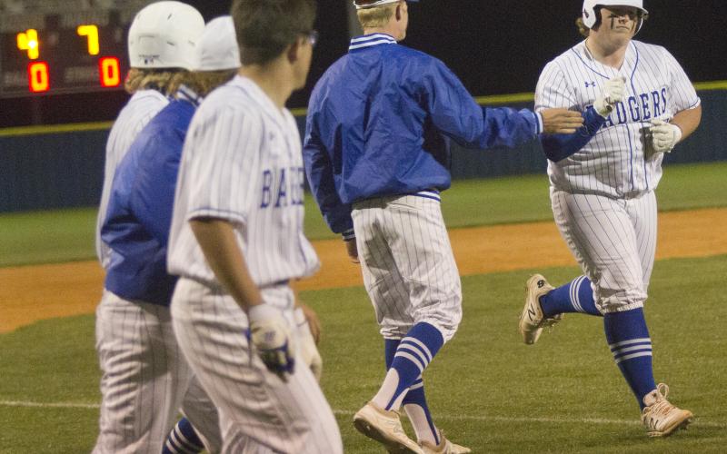 Teammates congratulate Hayden Waldrip, (far right) on a three-run home run in the bottom of the seventh against Gatesville on Thursday.