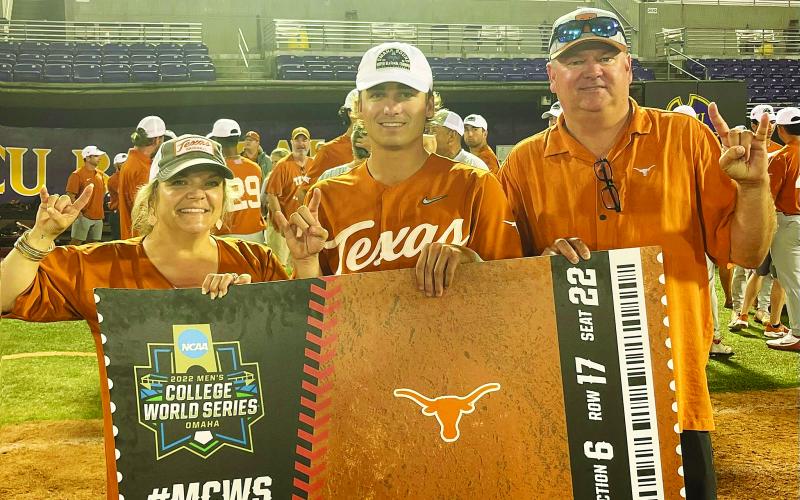 Kenna Whitehead, left, Ace and his dad Kirk Whitehead hold the Longhorns ticket to Omaha after the game three victory. COURTESY PHOTO