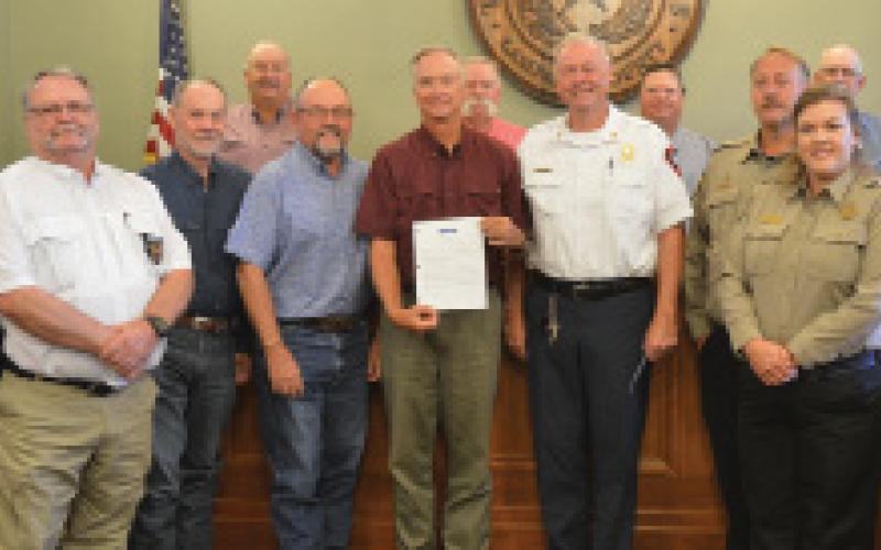 On Monday, the Lampasas County Commissioners Court approved a proclamation recognizing July as “First Responders Month.” Pictured are area first responders, Hill Country 100 Club directors and the Lampasas County Commissioners Court members.