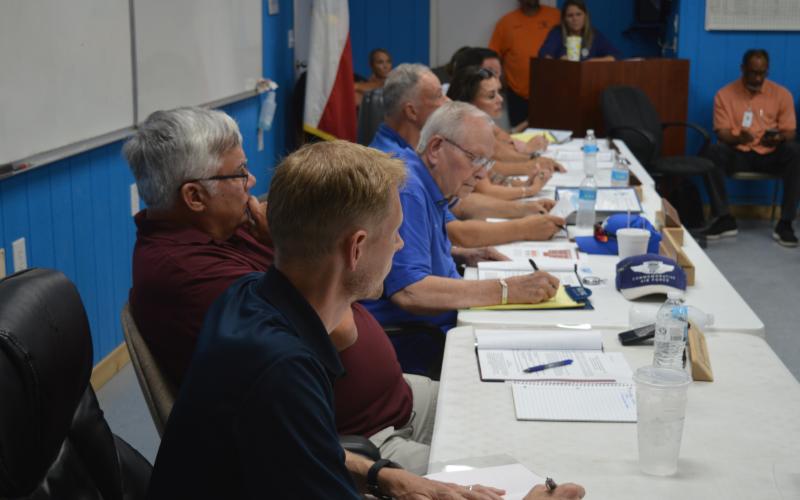 KWSC Board Members listen to questions from citizens during KWSC's board meeting on Wednesday evening.
