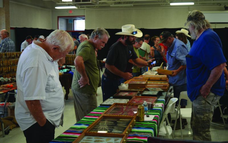Attendees view offerings at last year's Indian Artifact, Gem, and Mineral Show. FILE PHOTO