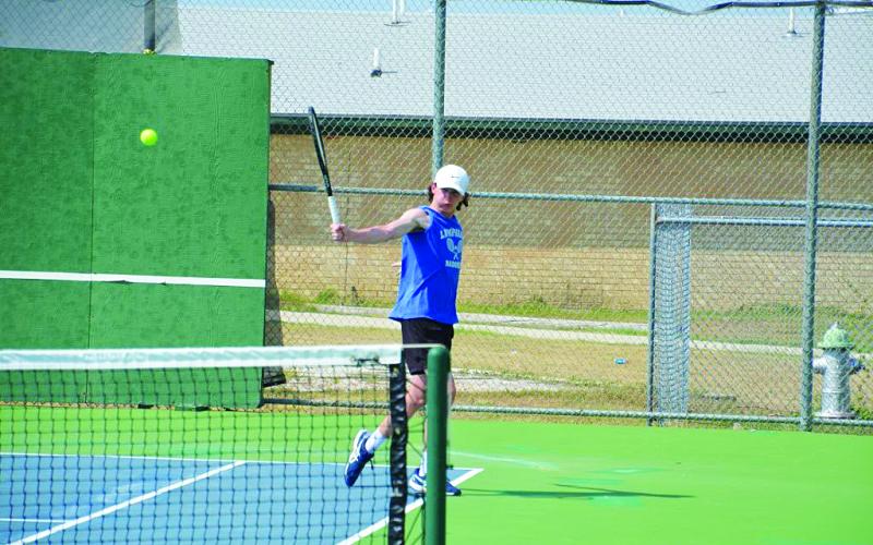 Elijah Copeland follows through on a backhand shot during last week's match. COURTESY PHOTO | KENNETH PEISER