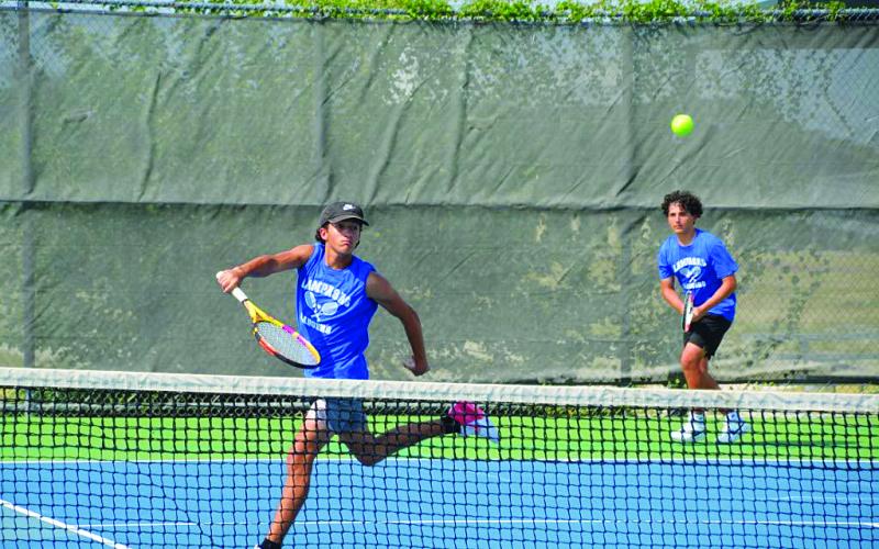 Brock Messinger, front, and Jacob Pronovost won their doubles match against Ellison. COURTESY PHOTO | KENNETH PEISER