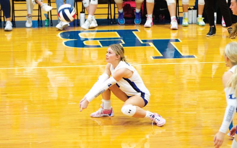 Scout Barton goes down for a dig during the Lady Badgers’ match against Salado on Tuesday.