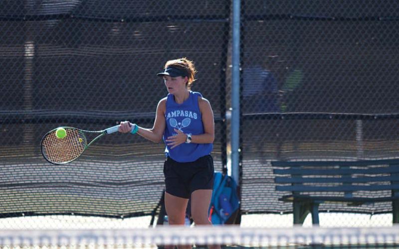 Caroline White plays a forehand shot during her doubles match against Gatesville.
