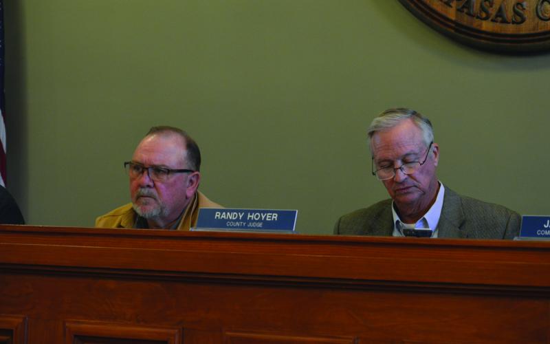 Precinct 3 Commissioner Shad Hill, at left, and County Judge Randy Hoyer listen as information is presented on septic systems. ERICK MITCHELL | DISPATCH RECORD