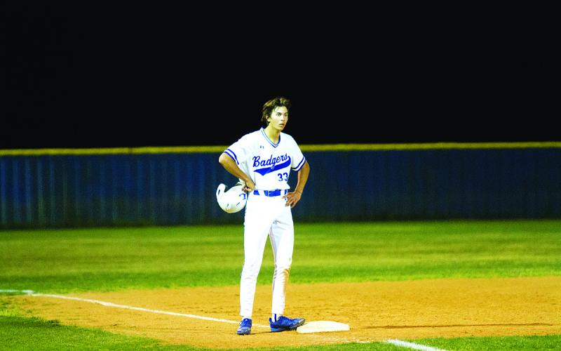 Jackson Wright catches his breath on base in a game earlier this season. HUNTER KING | DISPATCH RECORD