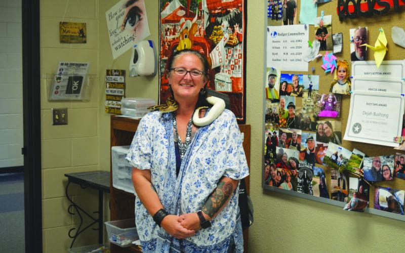 Lampasas High School science teacher Dejah Bushong and her ball python each shed a smile for the camera. Bushong was named Lampasas ISD’s secondary teacher of the year. ERICK MITCHELL | DISPATCH RECORD