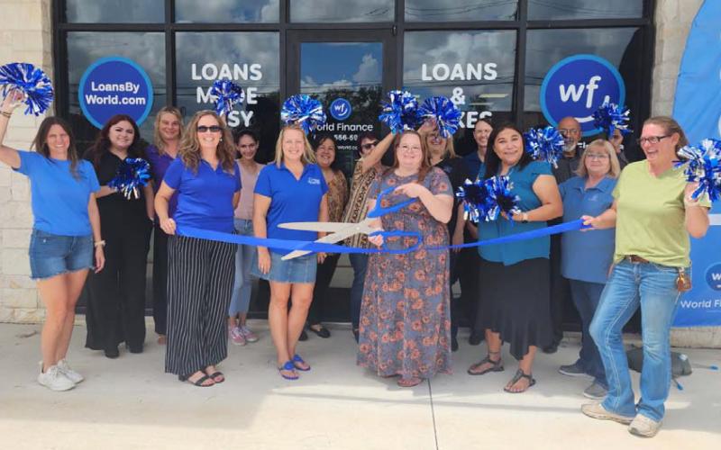 World Finance recently held a ribbon-cutting event at its new location at 1010 E. Fourth St. in Lampasas. Holding the ceremonial scissors is Branch Manager Michelle Blankenship. She is joined by World Finance employees and management, as well as Chamber of Commerce staff and board members