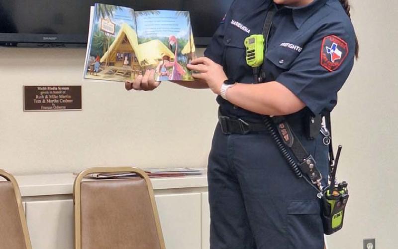 Alyssa Mariduena of the Lampasas Fire Department was one of several community representatives participating in the Aug. 16 “See You at the Library” event. Book reading and fun activities promoted faith, family and freedom.