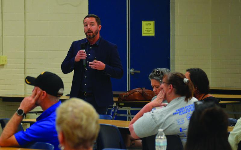Justin Bell, of WRA Architects, presents costs of potential bond projects to committee members. ERICK MITCHELL | DISPATCH RECORD