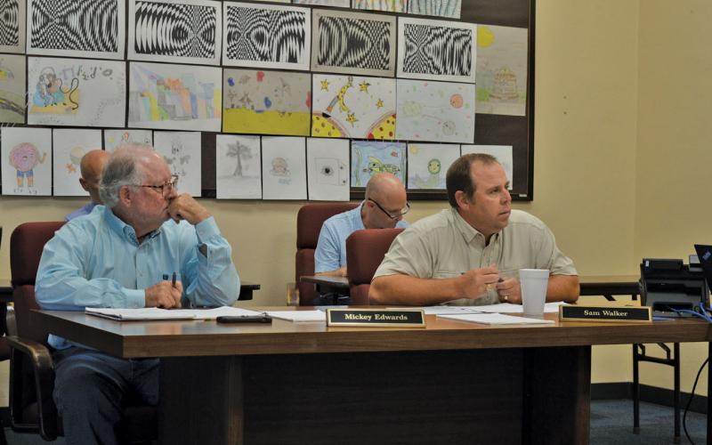 From left, Lampasas ISD Board of Trustees Place 1 Mickey Edwards and Place 6 Sam Walker look on during Tuesday's meeting. ERICK MITCHELL | DISPATCH RECORD