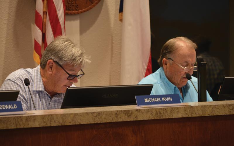 Lampasas EDC Board of Directors Place 7 Michael Irvin and Board President Deorald Finney look on during Wednesday's regular meeting. ERICK MITCHELL | DISPATCH RECORD