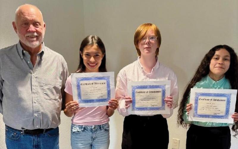 Texas history teacher James Best helped recognize his students who were named winners of the DRT Essay Contest on “Three flags over Texas.” With him are, from left to right, second-place winner Mia Summer, first-place winner Willow White and third-place winner Esmeralda Olalde. Not pictured: fourth-place winner Brooklyn Jones. COURTESY PHOTO