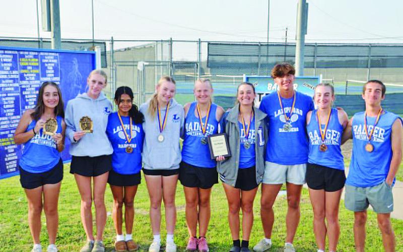 The tennis team shows off their medals from Marble Falls. HUNTER KING | DISPATCH RECORD