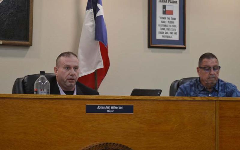Mayor John Wilkerson, at left, and Councilman Rob Green listen to administrative reports during Tuesday night’s Kempner City Council meeting. ERICK MITCHELL | DISPATCH RECORD