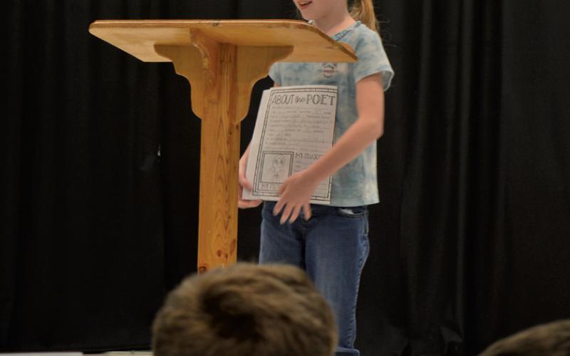 Aurora King concludes the reading of her poem to a thunderous applause from the observers present at Friday’s Poetry Cafe. erick mitchell | dispatch record