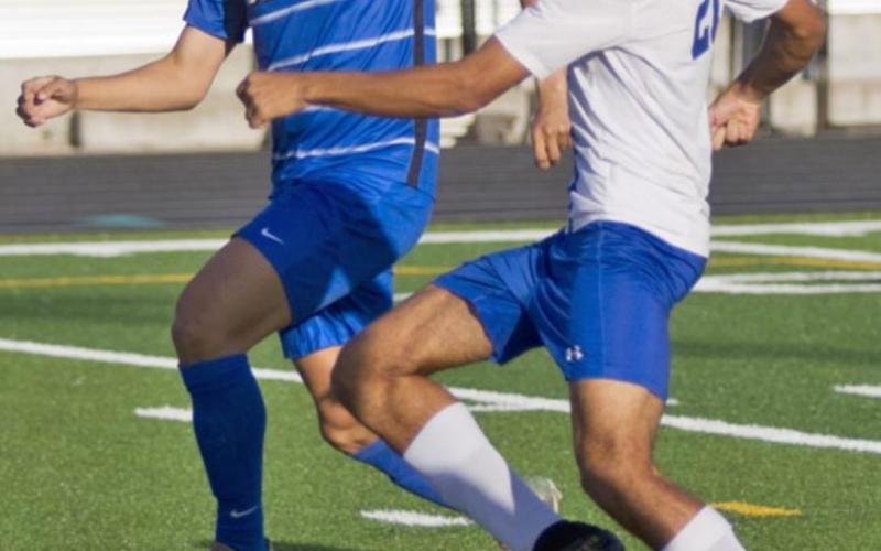 Andrew Grant (21) scores the Badgers’ first goal in the opening minutes of Friday’s bi-district match against Robinson. JEFF LOWE | DISPATCH RECORD